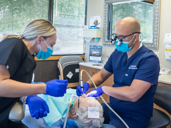 Dentist talking to dental patient