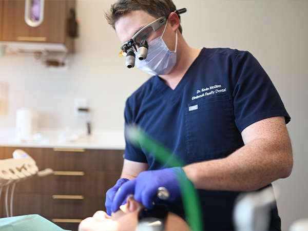 Dentist talking to dental patient