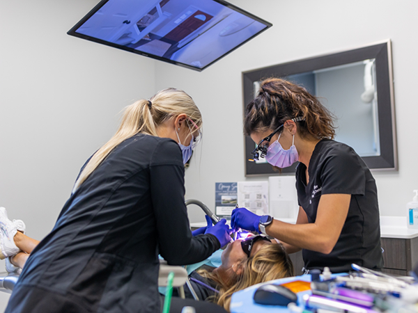 Dental patient receiving an oral cancer screening