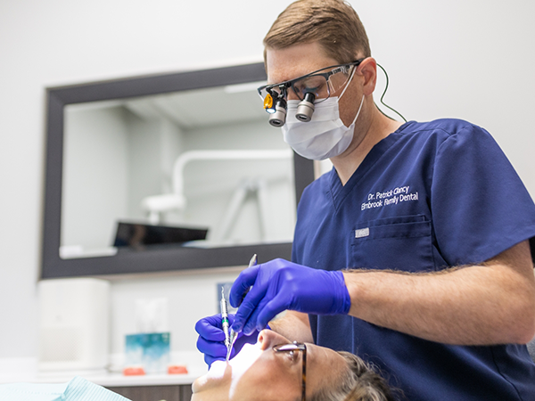 Dental patient receiving an oral cancer screening